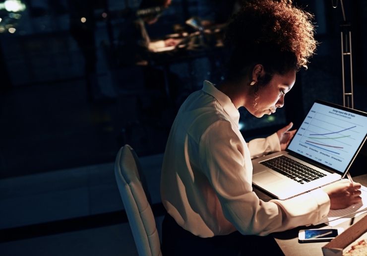 Vertical spotlight size woman at desk writing